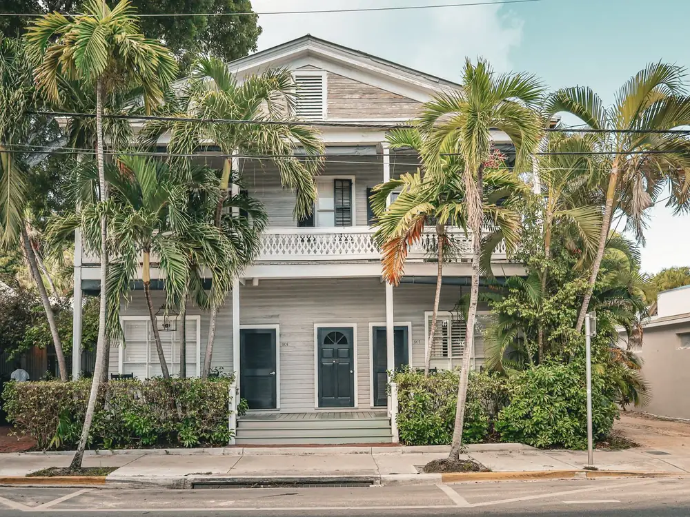 Two storey Florida house with palm trees in front