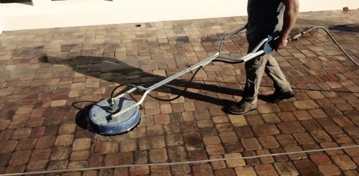 Rotary surface cleaner cleaning brick paver flatwork